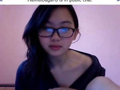 Young and pretty Asian nerd offers a sexy sneak peek of her