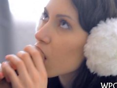 she is sucking as she has ear muffs on