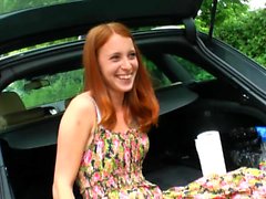 Petite redhead girl masturbates in her car