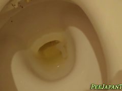 Asian teen pees in toilet