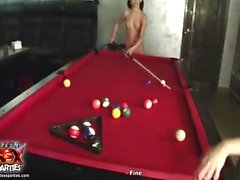 Teenage girls playing pool naked