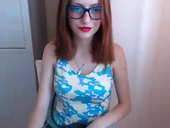 Sultry redhead teen with glasses flashes her sweet ass on t