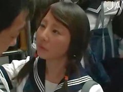 Japanese teen girl sucks in a bus