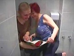 Mature redhead takes young cock in bathroom